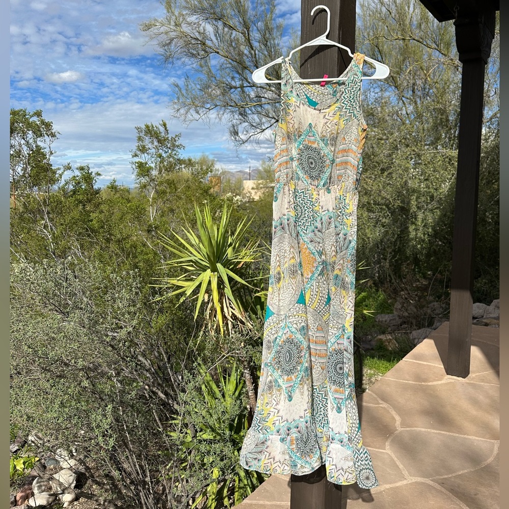 Multicolor sheer dress with geometric pattern and ruffled bottom